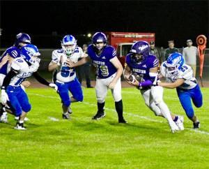 Sequims Liam Wiker had two rushing touchdowns and a 41-yard catch and run against Elma on Friday night as the Wolves won 49-30. (Jacques Star/Olympic Peninsula News Group)
