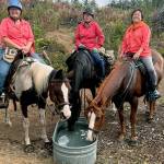 Photo by Helen Shrewman
Prize riders Michelle Neville, on Ellie, (Spanaway) left, Mary Quinn, on Scarlet, (Tahoma) and Camille Rucker, on Fancy (Rainier) take a break along the trail at the Snack Water Stop (set up for the ride by Peninsula Chapt).