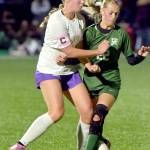 KEITH THORPE/PENINSULA DAILY NEWS Sequims Hailey Wagner, left, and Port Angeles Teanna Clark tangle for the ball on Thursday night at Peninsula College.