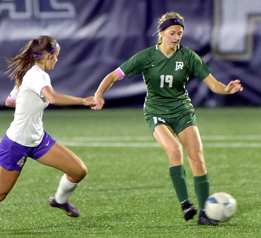 KEITH THORPE/PENINSULA DAILY NEWS
Port Angeles' Becca Manson, right, works to keep control as Sequim's (#4) approaches in midfield on Thursday at Wally Sigmar Field.