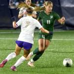 KEITH THORPE/PENINSULA DAILY NEWS
Port Angeles' Morgan Politika, right, charges past Sequim's (#7) during Thursday night's match in Port Angeles.