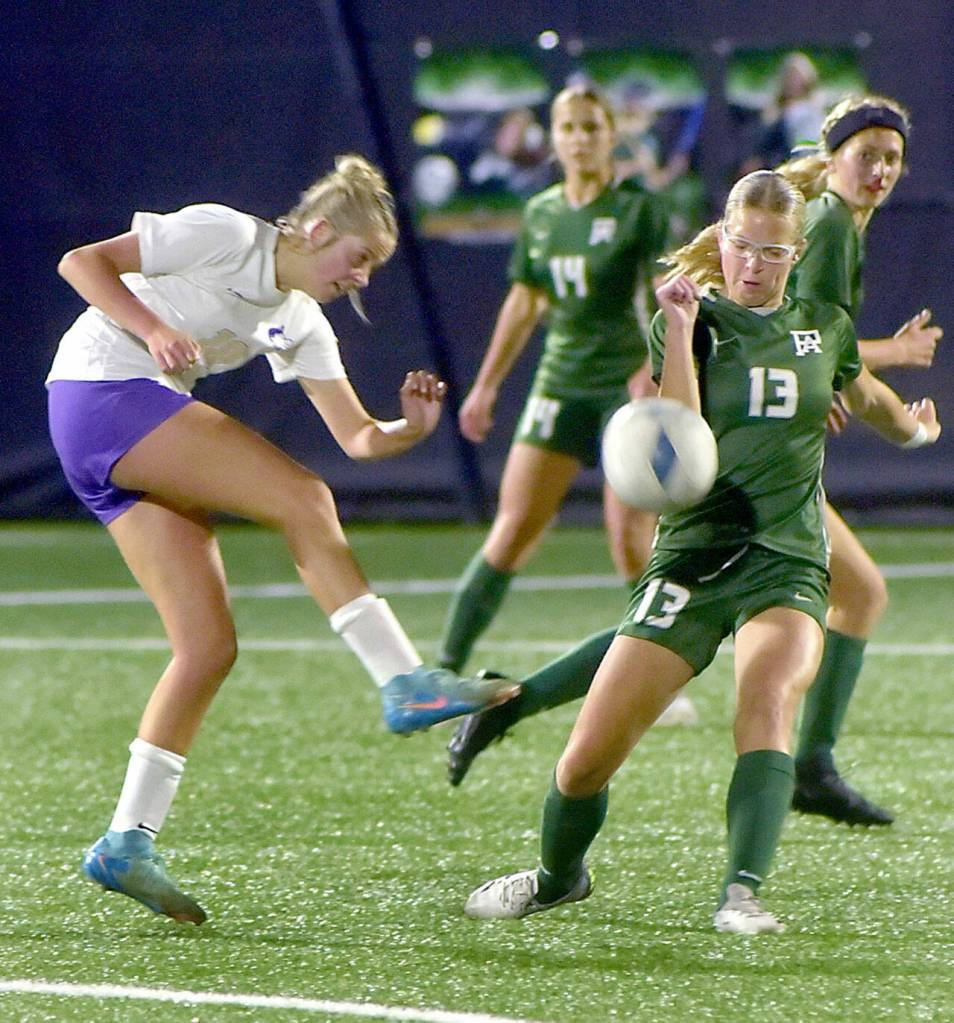 KEITH THORPE/PENINSULA DAILY NEWS
Sequim's (#10), left, passes the ball past Port Angeles' Brooke Pierce as Pierce's teammates Sophia Ritchie and Becca Manson prepare to give chase on Thursday in Port Angeles.