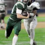 KEITH THORPE/PENINSULA DAILY NEWS
Port Angeles' Jude Wallace, left, slips by the defense of Sequim's Josiah Tuller on Friday night at Port Angeles Civic Field.