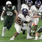 KEITH THORPE/PENINSULA DAILY NEWS
Sequim's Liam Wiker, center, looks for blocking from his teammates as Port Angeles' Taylor Abold closes in at left on Friday night in Port Angeles.