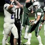 KEITH THORPE/PENINSULA DAILY NEWS Sequims Patrick Elias, left, expresses disbelief after Port Angeles Jude Wallace, right, completed a pass reception near the Sequim goal line while teammate Taylor Abold celebrates during Friday nights game in Port Angeles.