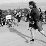 KEITH THORPE/PENINSULA DAILY NEWS
Big Hurt iron man competitor Joey Gish of Sequim races through the transfer zone on the way to his kayak after finishing the mountain bike leg of the race in first place on Saturday at Pebble Beach Park in Port Angeles. Gish finished second in the iron division in the 2024 Big Hurt
