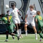 KEITH THORPE/PENINSULA DAILY NEWS Peninsulas Jeremie Kuelo, center, makes the header as teammate Lovis Bienefeld keeps watch surrounded by Shoreline defenders, from left, Shaqir Diallo, Adrian Montenegro and Elie Peseyre on Saturday at Wally Sigmar Field.