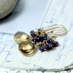 A pair of citrine sapphire earrings created by Lore Del La Portilla, the Port Ludlow Art Leagues October jeweler of the month.