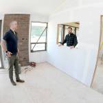 Trevor Sly, operations manager of Olympic Hiking Co., left, and Tommy Farris, company owner and general manager, discuss relocating their business from The Wharf on the Port Angeles Waterfront to a new office on West Marine Drive. (Keith Thorpe/Peninsula Daily News)