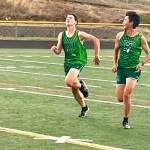 Port Angeles Killian Waknitz, left, is encouraged to reach a personal record by teammate Mason Mai