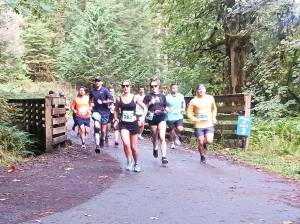 Runners begin heading up the hill between the starting line and the McFee Tunnell at the Spruce Railroad Trail run Saturday. (Pierre LaBossiere/Peninsula Daily News).