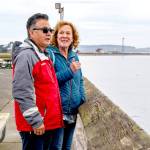 Saul and Suzanna Martinez of Monroe take in the view over the Salish Sea from Fort Worden State Park on Thursday. The couple enjoyed a quick trip to Port Townsend to celebrate their 37th wedding anniversary. (Steve Mullensky/for Peninsula Daily News)