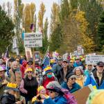 Protestors milling about at Kai Tai Lagoon on Saturday in anticipation of a march along Sims Way and Water Street to downtown Port Townsend. (Steve Mullensky/for Peninsula Daily News)