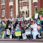 A crowd gathers on the lawn of the Clallam County Courthouse on Saturday for one of two No Kings rallies in Port Angeles protesting the policies of President Donald Trump and his administration. Several hundred people attended the courthouse demonstration with about a thousand at a concurrent rally at the intersection of First and Front streets on the east side of the city. (Keith Thorpe/Peninsula Daily News)