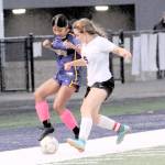 Forks Vivi Luna competes with Ocostas Penny Park for ball control Monday at Spartan Staidum. The game ended in a 1-1 tie. (Lonnie Archibald/for Peninsula Daily News)