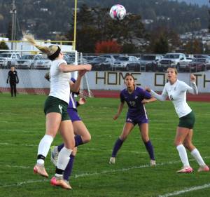 Matthew Nash/Olympic Peninsula News Group 
Port Angeles Mariah Traband, left, heads a ball past Sequims Harper Moore and toward teammate Morgan Politika, right, and Sequims Brooklynn Schmidt during a game earlier this month.