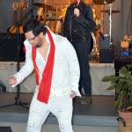 Old and young Elvis is portrayed by Michael Rief, in the white jumpsuit, and Nicholas Bell, singing at the mic.