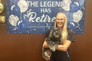 Jackie Anderson, with Jax, has retired as officer manager for Sequim Animal Hospital after 32 years with the business. I love the animals, but I love my clients because they love their animals in the good times and the bad times, she said. Im going to miss the people. (Matthew Nash/Olympic Peninsula News Group)