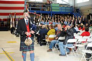 Bagpiper Rick McKenzie, who performed Amazing Grace during the 2023 regional Veterans Day ceremony in the hanger at U.S. Coast Guard Air Station/Sector Field Office Port Angeles, is scheduled to perform at this years ceremony, which will be held at the Port Angeles High School auditorium due to the federal government shutdown. (Keith Thorpe/Peninsula Daily News)