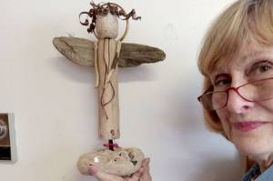 Candice Olsen displays one of the angels created for the Yuletide Bazaar at Dungeness Valley Lutheran Church. (Dungeness Valley Lutheran Church)
