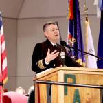 Retired Capt. John Hakanson of the U.S. Navy Chaplain Corps speaks about his military experience on Tuesday during a Veterans Day ceremony at the Port Angeles High School auditorium. (Dave Logan/for Peninsula Daily News)