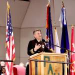 Retired Capt. John Hakanson of the U.S. Navy Chaplain Corps speaks about his military experience on Tuesday during a Veterans Day ceremony at the Port Angeles High School auditorium. (Dave Logan/for Peninsula Daily News)