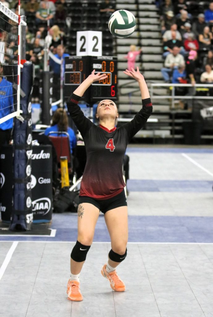 Setter Danika Perry keeps her eyes on the ball during Neah Bays Class 1B state volleyball tournament victory over Valley Christian. The Red Devils played for the 5th-6th-place trophy late Thursday at the Yakima Valley SunDome. Roger Harnack/Cheney Free Press
