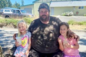 Kirky Lakenes bought milkshakes for his nieces Ava, left, and Mia Hathaway in Chimacum earlier this year.
