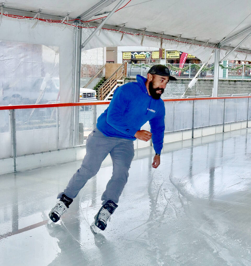Jamel Twigger tests out the ice in preparation for opening day on Fridayat the Winter Ice Village in Port Angeles. (Dave Logan/For Peninsula Daily News)