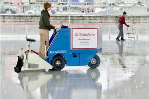 Volunteer Laken Folsom runs the ice resurfacing machine in preparation for opening day on Friday at the Winter Ice Village in Port Angeles. (Dave Logan/For Peninsula Daily News)