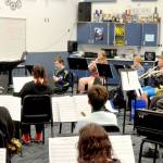 The Chimacum High School Cowboy band, which will march next July 4 in the national Independence Day Parade in Washington, D.C., rehearses holiday songs for an upcoming concert. (Elijah Sussman/Peninsula Daily News)