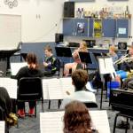 The Chimacum High School Cowboy band, which will march next July 4 in the national Independence Day Parade in Washington, D.C., rehearses holiday songs for an upcoming concert. (Elijah Sussman/Peninsula Daily News)