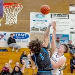 Sequim sophomore Andy Reynolds, at 6-foot-4, here shooting against Washington in Sequim on Saturday, looks to be a big contributor inside for the Wolves basketball team this season. (Emily Matthiessen/for Peninsula Daily News)