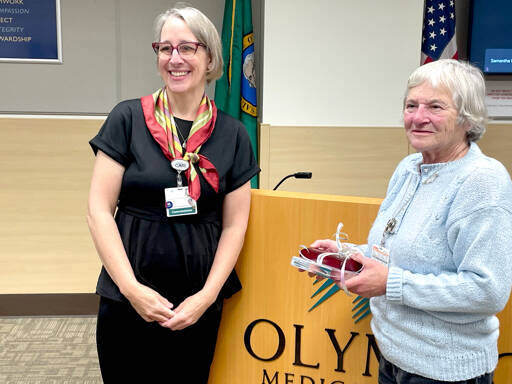 Olympic Medical Center Board President Ann Henninger, left, recognizes commissioner Jean Hordyk on Wednesday as she steps down after 30 years on the board. Hordyk, who was first elected in 1995, was honored during the meeting. (Paula Hunt/Peninsula Daily News)
Olympic Medical Center Board President Ann Henninger, left, recognizes commissioner Jean Hordyk on Wednesday as she steps down after 30 years on the board. Hordyk, who was first elected in 1995, was honored during the meeting. (Paula Hunt/Peninsula Daily News)