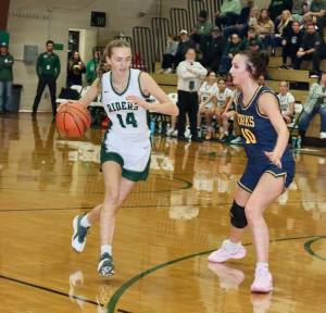 Dave Logan/for Peninsula Daily News 
Forks Avery Dilley defends against Port Angeles Storey Schmidt during the teams season opener last week.