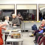 Chef Arran Stark speaks with attendees as they eat ratatouille  mixed roasted vegetables and roasted delicata squash  that he prepared in his cooking with vegetables class. (Elijah Sussman/Peninsula Daily News)