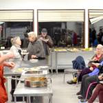 Chef Arran Stark speaks with attendees as they eat ratatouille  mixed roasted vegetables and roasted delicata squash  that he prepared in his cooking with vegetables class. (Elijah Sussman/Peninsula Daily News)