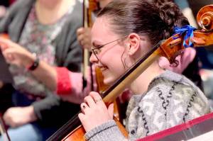 Cellist Joanna Minnoch, shown in rehearsal, is among the 75 Port Angeles Symphony musicians preparing for Saturdays Holiday Concert. (Diane Urbani de la Paz/For Peninsula Daily News)