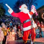 Santa greets well wishers who showed up at Haller Fountain in Port Townsend on Saturday to witness the lighting of the community Christmas tree. About four hundred fans of all ages turned out for the annual event. (Steve Mullensky/for Peninsula Daily News)