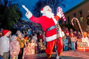Santa greets well wishers who showed up at Haller Fountain in Port Townsend on Saturday to witness the lighting of the community Christmas tree. About four hundred fans of all ages turned out for the annual event. (Steve Mullensky/for Peninsula Daily News)