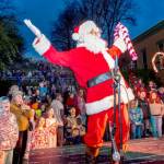 Santa greets well wishers who showed up at Haller Fountain in Port Townsend on Saturday to witness the lighting of the community Christmas tree. About four hundred fans of all ages turned out for the annual event. (Steve Mullensky/for Peninsula Daily News)