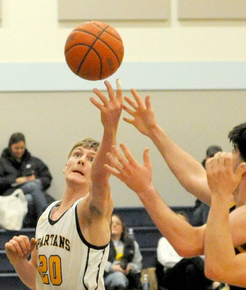 Ty Rowley (20) is the biggest returning player for the Forks Spartans this year. Rowley scored 36 points and pulled down 18 rebounds in a win this week against Hoquiam and is part of a big squad for the Spartans. (Lonnie Archibald/for Peninsula Daily News)