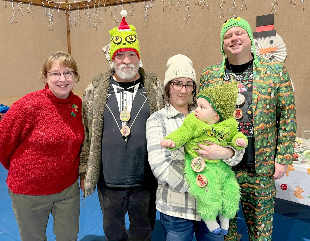 Pictured, from left, are Rae Leiper, president of the Joyce Fire Auxiliary; Keith Sowders, runner-up Grinch; Larrissa Garrison with Jayce, the 2025 Joyce Grinch; and second runner-up Grinch Brian Rice.
