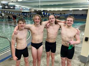 Port Angeles 400-yard free relay team achieved a state-qualifying time, improving their previous best by two seconds during the Riders swim meet against defending state-champion Bainbridge at Shore Aquatic Center on Wednesday in Port Angeles. Swimmers are, from left, Patrick Ross, Miles Van Denburg, Adam Kaminski and Thomas Jones.