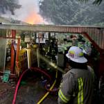Clallam 2 Fire-Rescue personnel fight a residential structure fire in the 2000 Block of Dan Kelly Road on Wednesday. (Clallam 2 Fire Rescue)