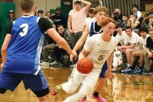 Daniel Benoit drives the ball up the court against Elma in Port Angeles' first home game of the year Saturday. The Riders overcame an 18-0 Elma run to win in the fourth quarter 56-50. (Dave Logan/for Peninsula Daily News)