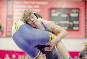 East Jefferson's Jackson Dupuy performs a takedown of a Forks wrestler at East Jefferson's team duals held this weekend. (Ava Fletcher)