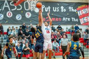 East Jefferson's Dillon Page-Castillo battle for a rebound against defending state champion Annie Wright in a game Tuesday in Port Townsend. Annie Wright won 89-44. (Steve Mullensky/for Peninsula Daily News)