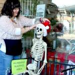 Tippy Munger, an employee at Olympic Stationers on East Front Street in Port Angeles, puts out a welcoming display for holiday shoppers just outside the business door every day. She said several men have sat there waiting while their wives shop inside. (Dave Logan/for Peninsula Daily News)