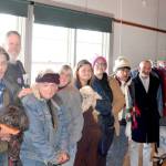 From left to right, Frank Hill, holding his dog Stoli, Joseph D. Jackson, Arnold Lee Warren, Executive Director Julia Cochrane, monitor Janet Dizick, holding dog Angel, Amanda Littlejohn, Fox and Scott Clark. (Elijah Sussman/Peninsula Daily News)